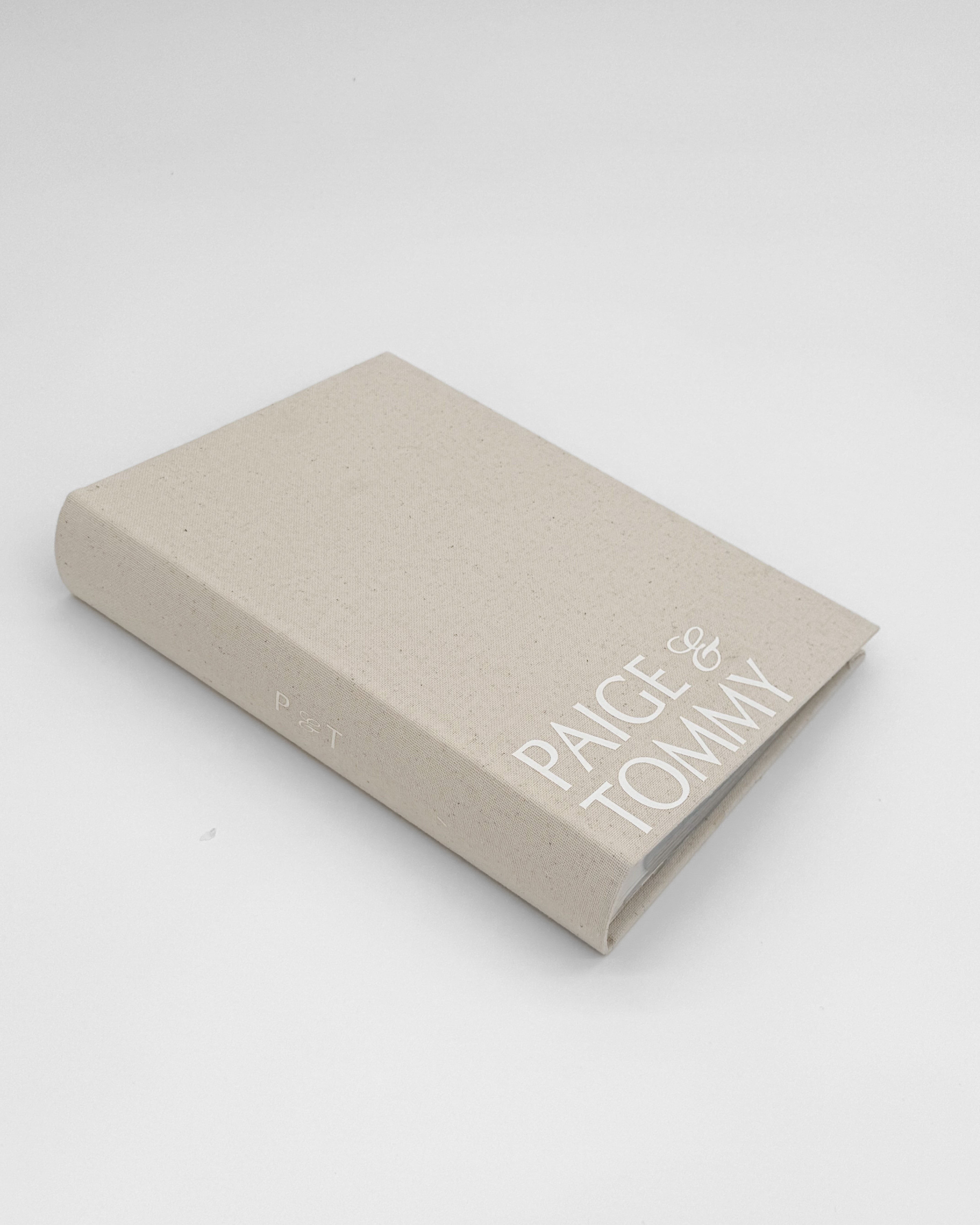 Personalized wedding photo album with custom couple names on linen cover for modern brides