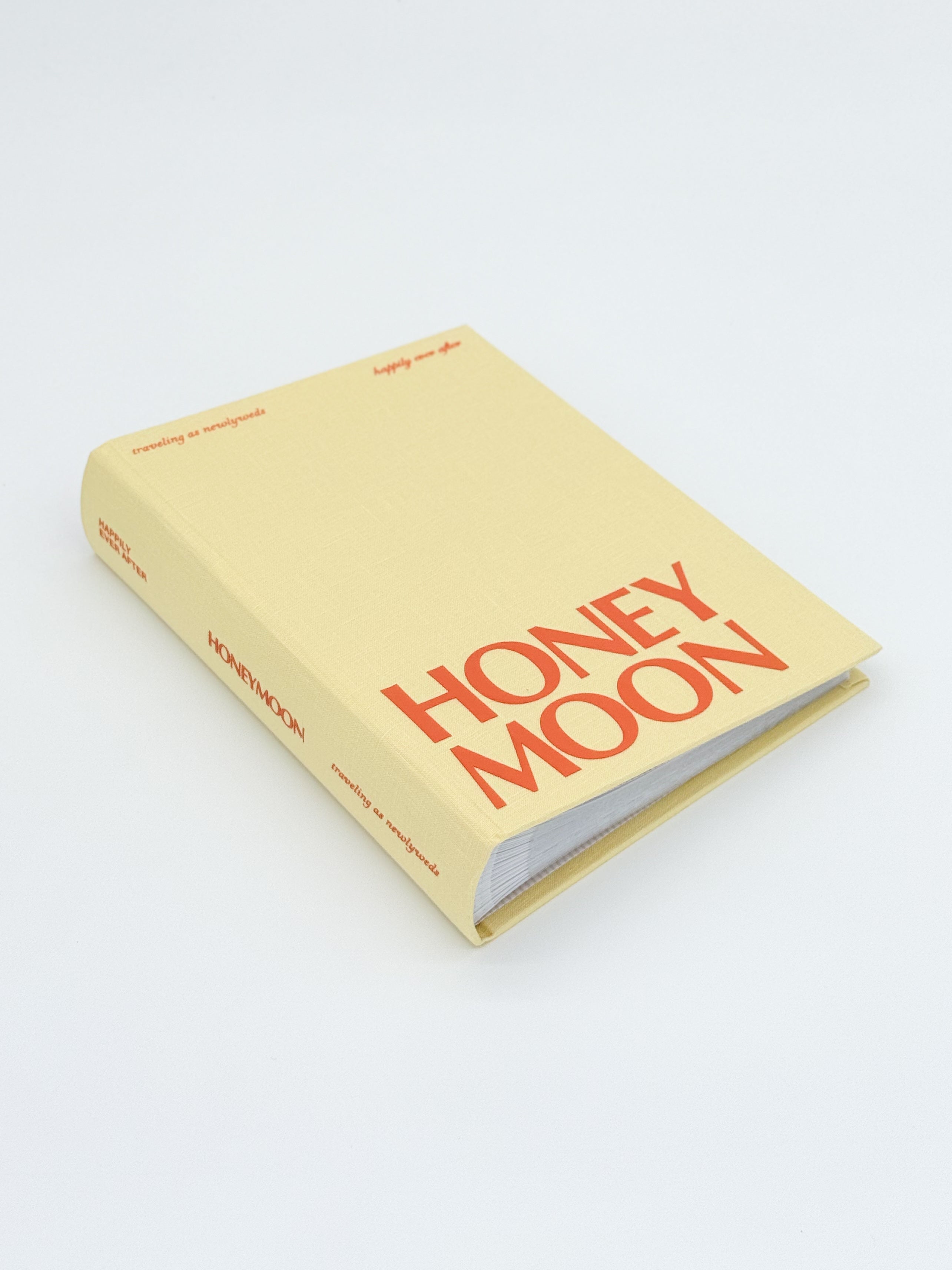 A beautifully designed honeymoon photo album capturing memories from summer travels, including beaches, sunsets, and romantic getaways