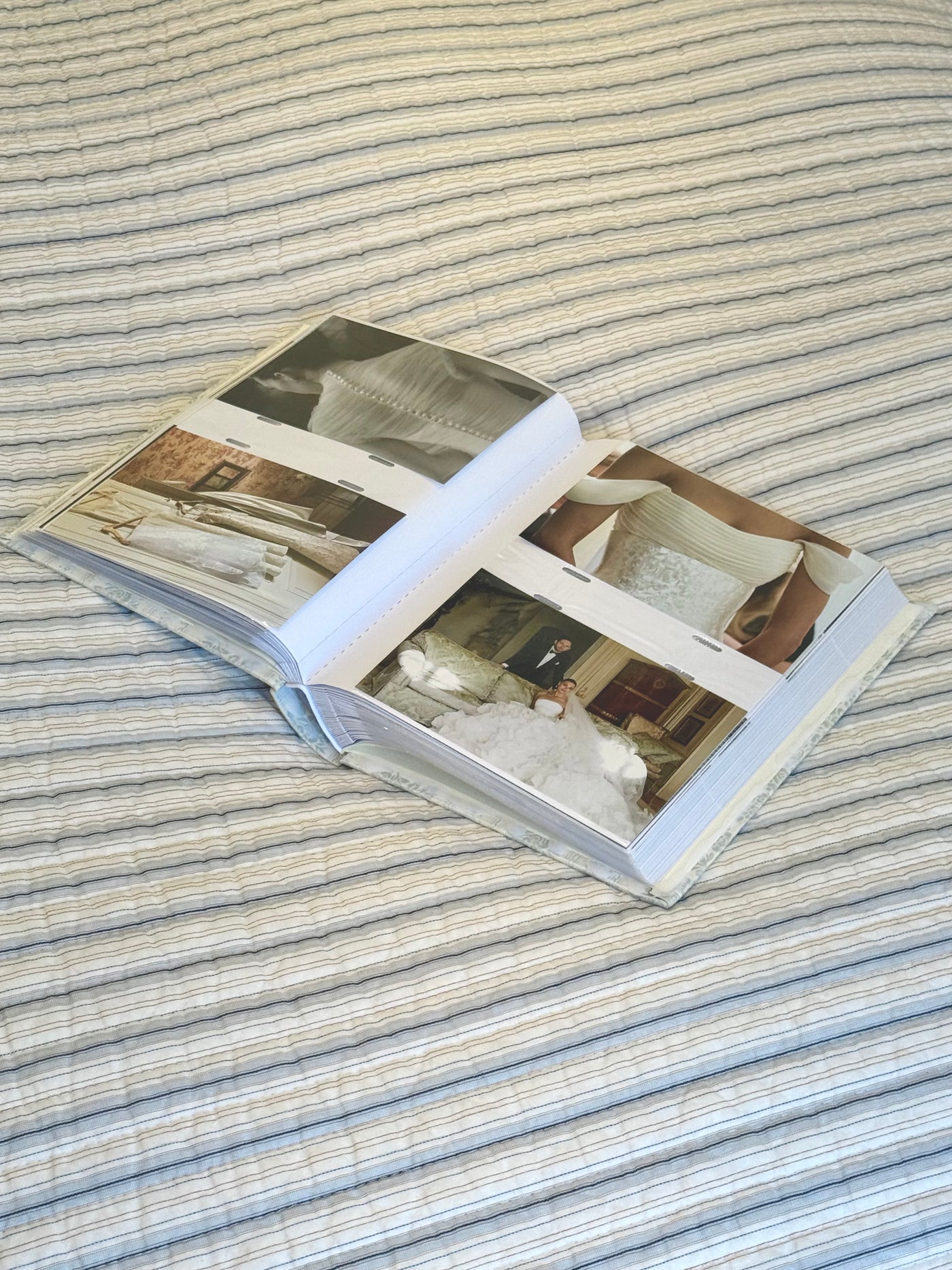 Open wedding photo album showing printed photographs